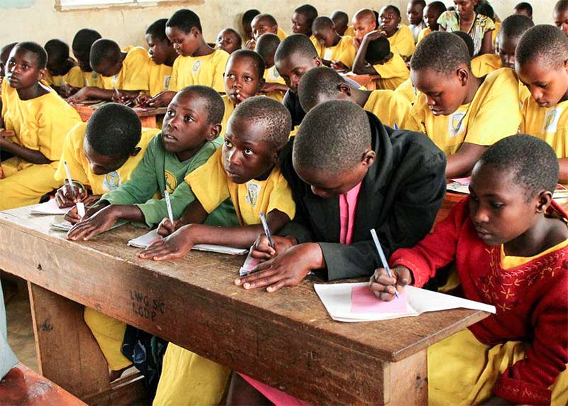 children in Uganda learning at school