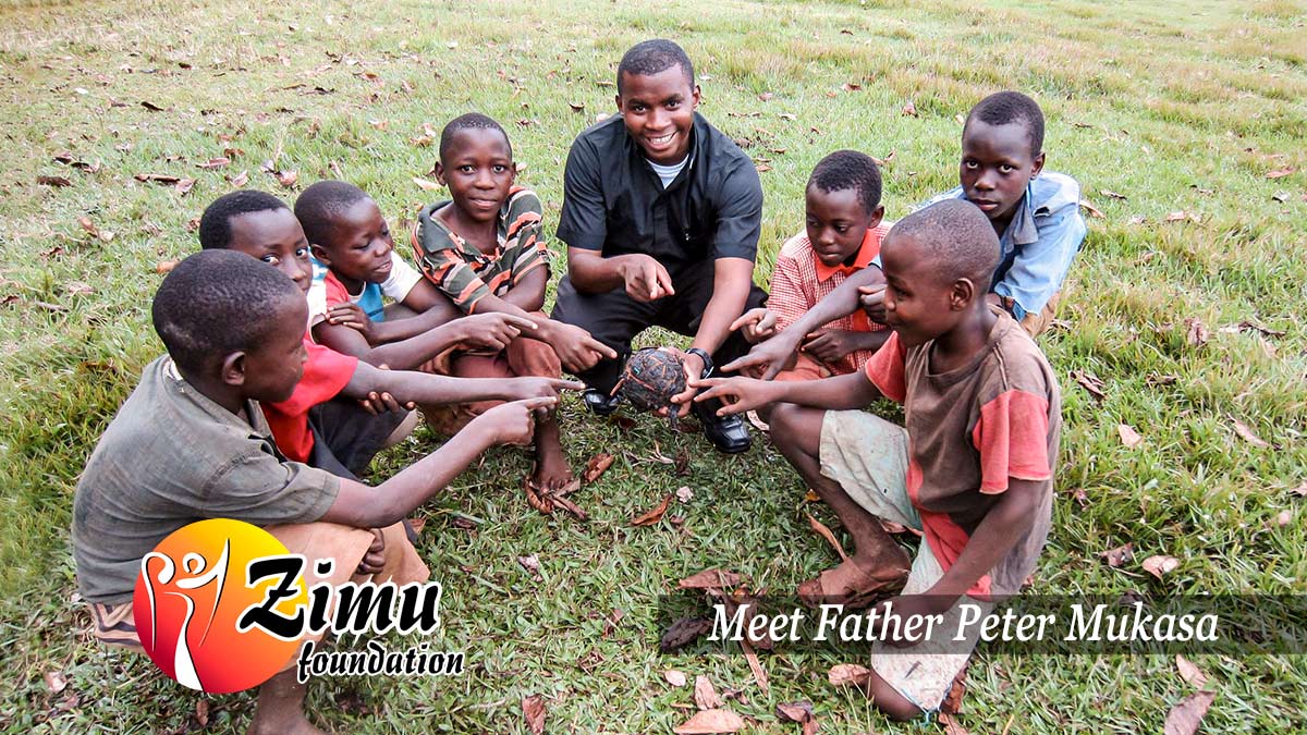 Fr. Peter Mukasa with boys playing sports